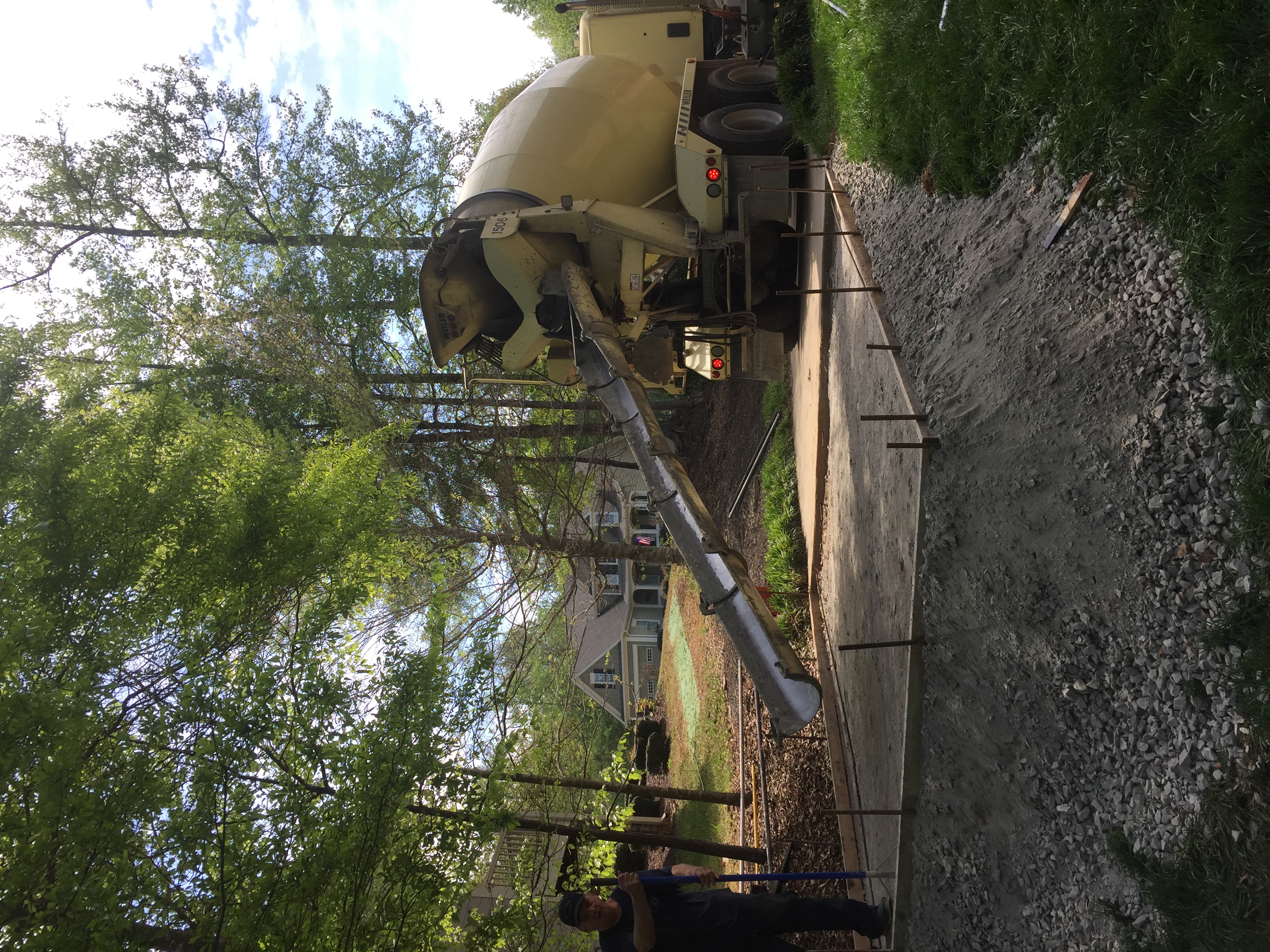 Rear image of a truck pouring a new concrete driveway