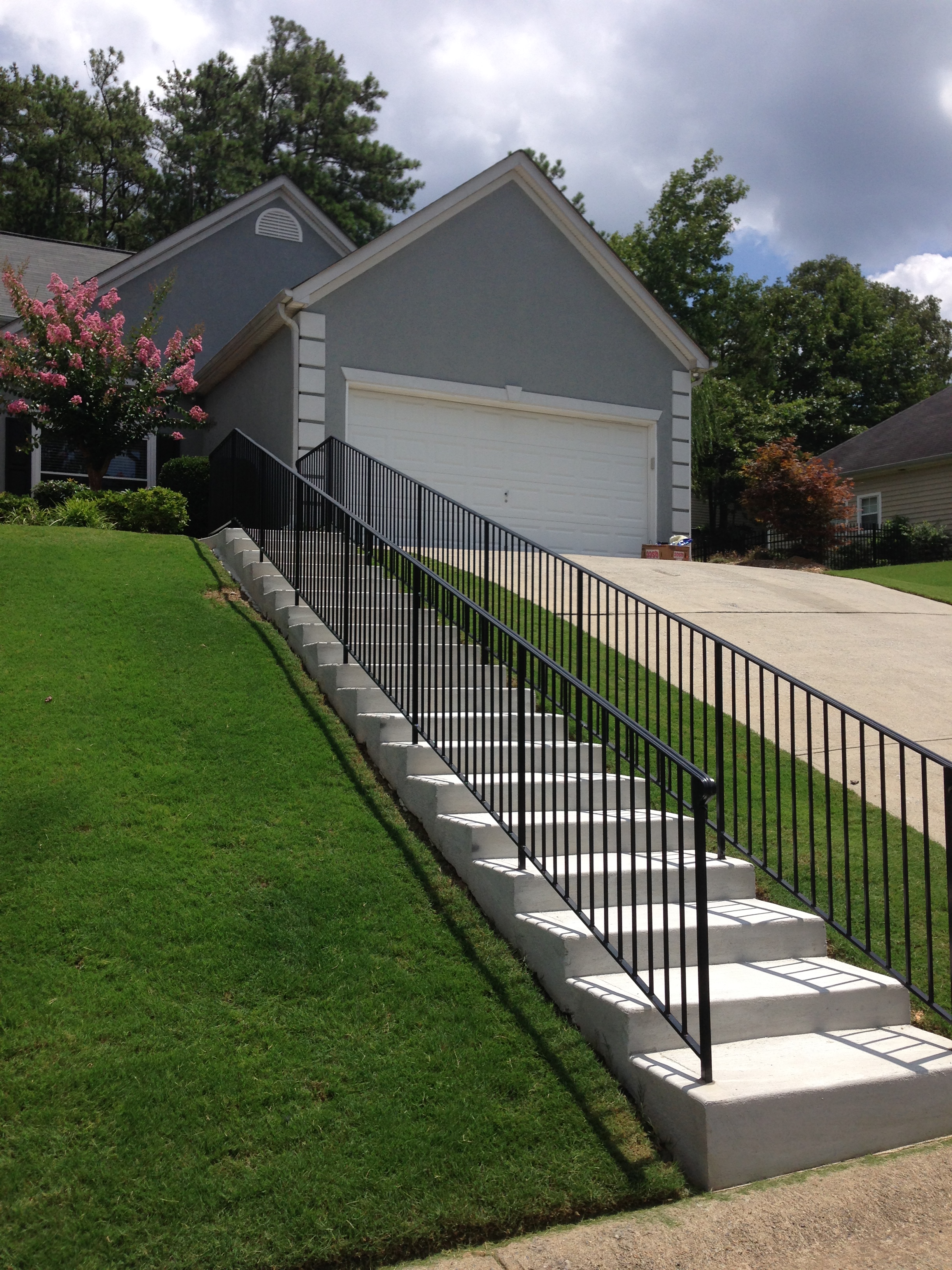 Newly constructed concrete stairs outside a home.